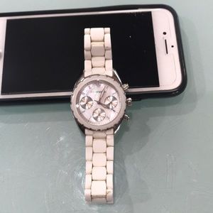White Armani watch. Fits small to medium wrist.